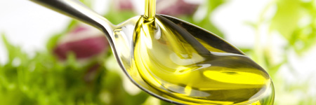 oil pouring into spoon